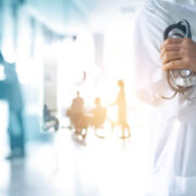 Healthcare and medical concept. Medicine doctor with stethoscope in hand and Patients come to the hospital background.