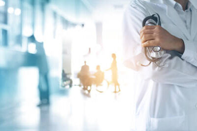 Healthcare and medical concept. Medicine doctor with stethoscope in hand and Patients come to the hospital background.
