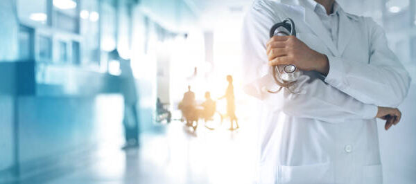 Healthcare and medical concept. Medicine doctor with stethoscope in hand and Patients come to the hospital background.